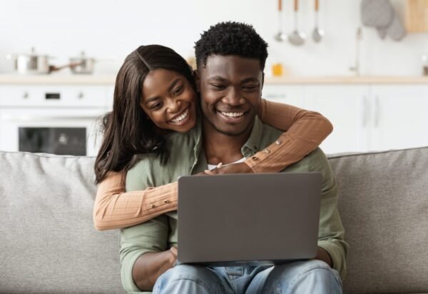 Closeup of african american family using computer at home Closeup of african american family using computer at home