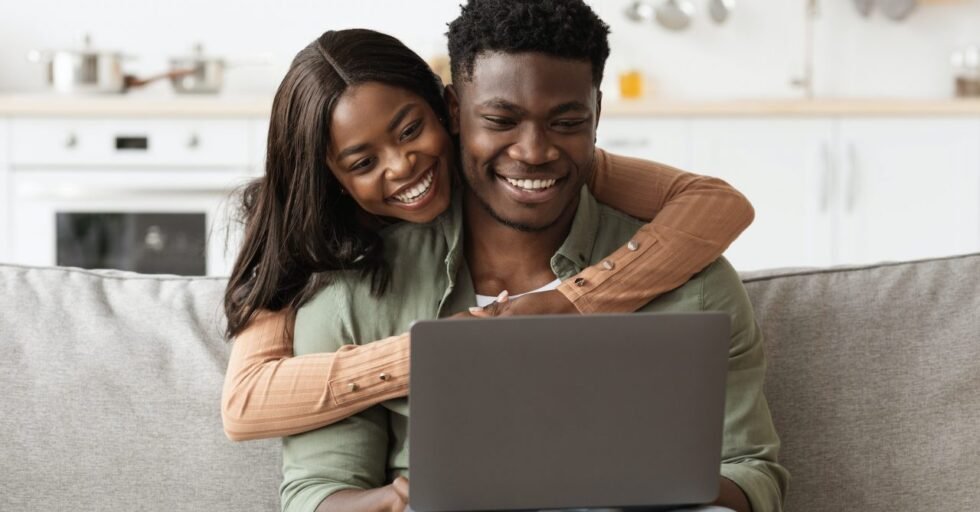Closeup of african american family using computer at home Closeup of african american family using computer at home