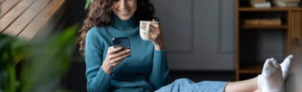 Remote worker girl procrastinate at workplace sit at desk with closed laptop chat in social media