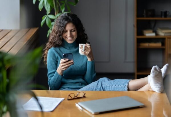 Remote worker girl procrastinate at workplace sit at desk with closed laptop chat in social media Remote worker girl procrastinate at workplace sit at desk with closed laptop chat in social media