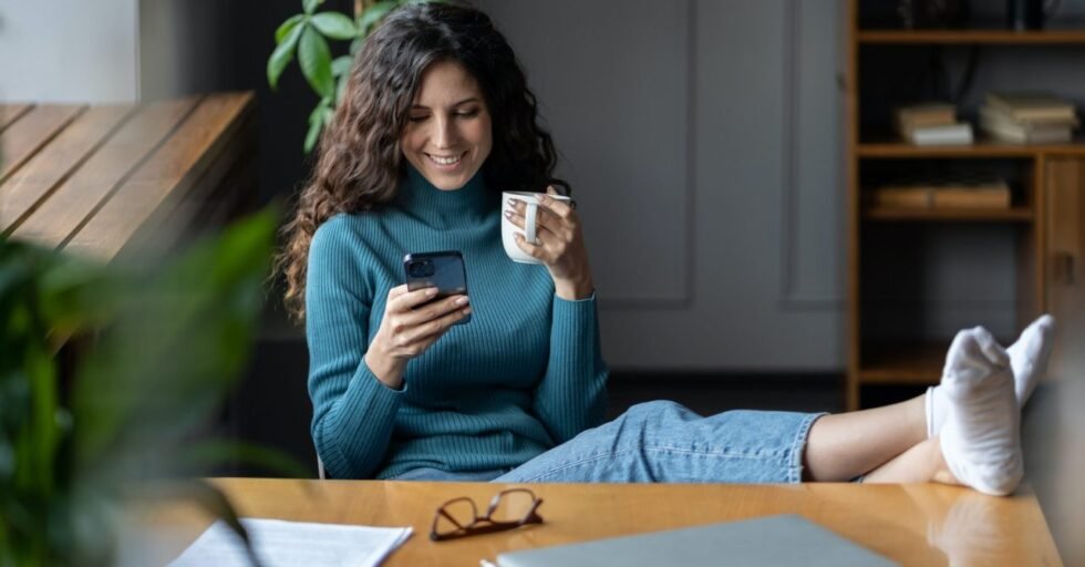 Remote worker girl procrastinate at workplace sit at desk with closed laptop chat in social media Remote worker girl procrastinate at workplace sit at desk with closed laptop chat in social media